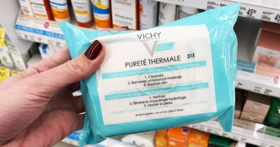 hand holding vichy makeup remover wipes with hand