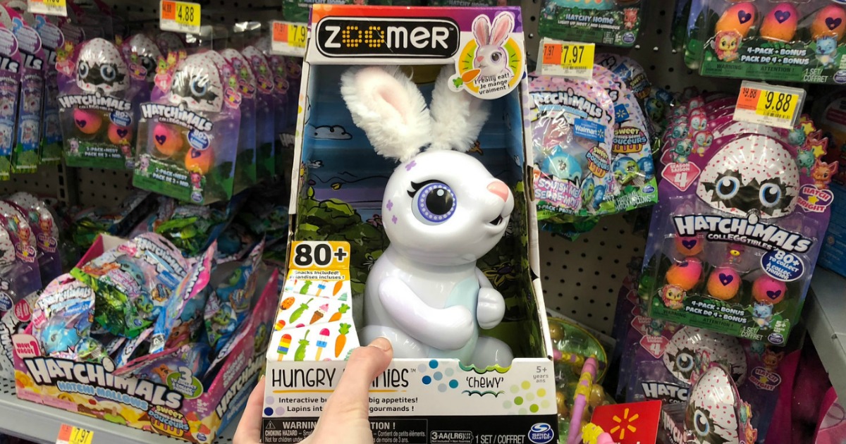 hand holding Zoomer Hungry Bunnie Chewy in a store at the toy aisle
