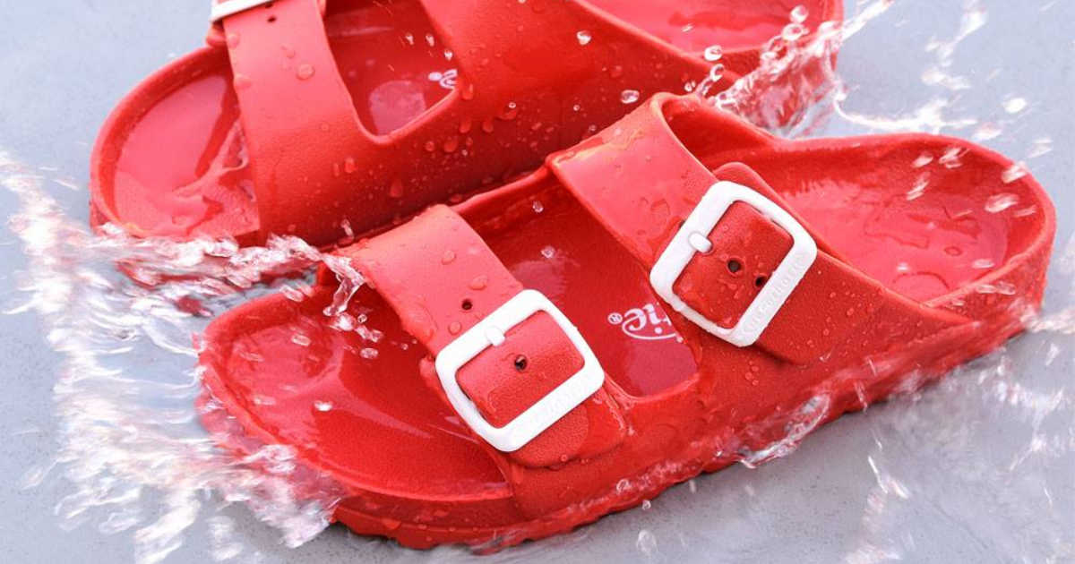 pair of red sandals in water