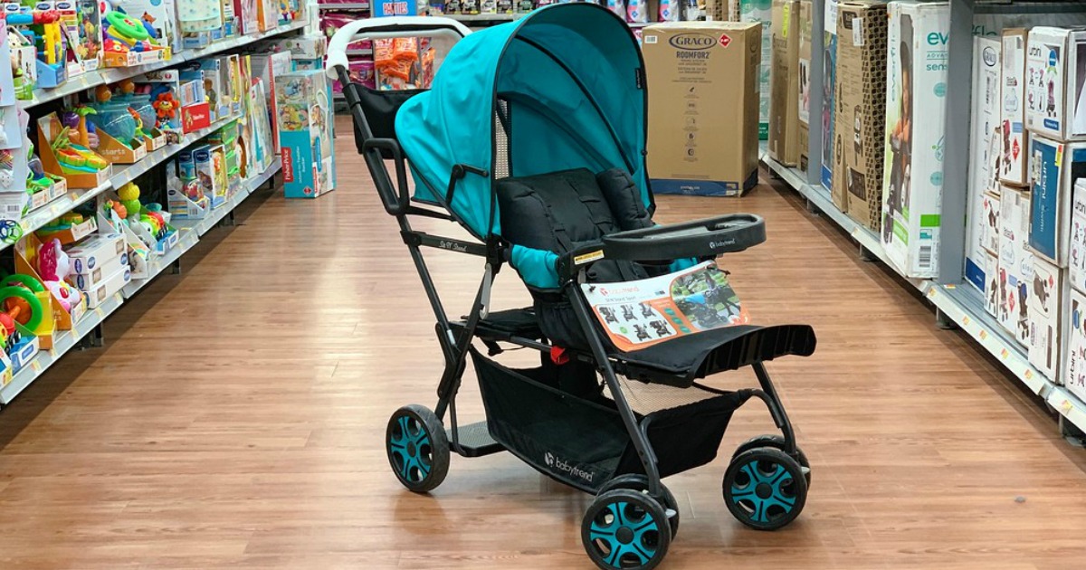 stroller sitting in the middle of a store aisle