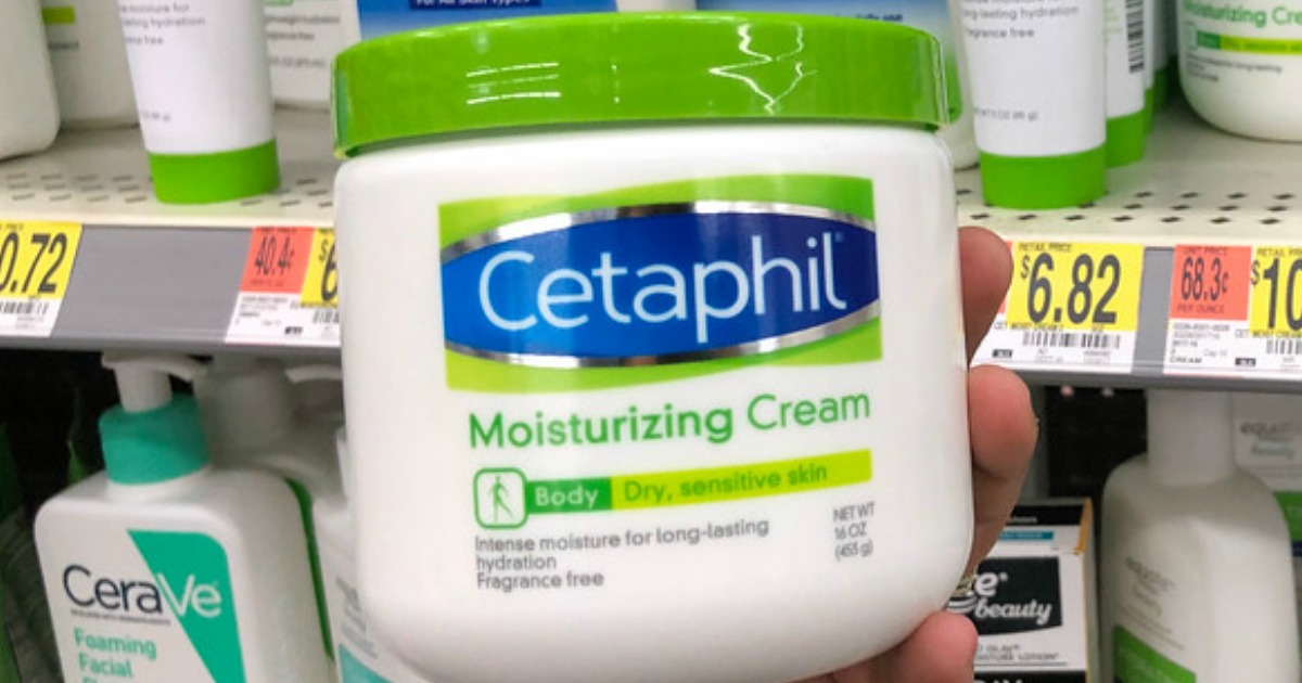 hand holding jar of cetaphil moisturizing cream