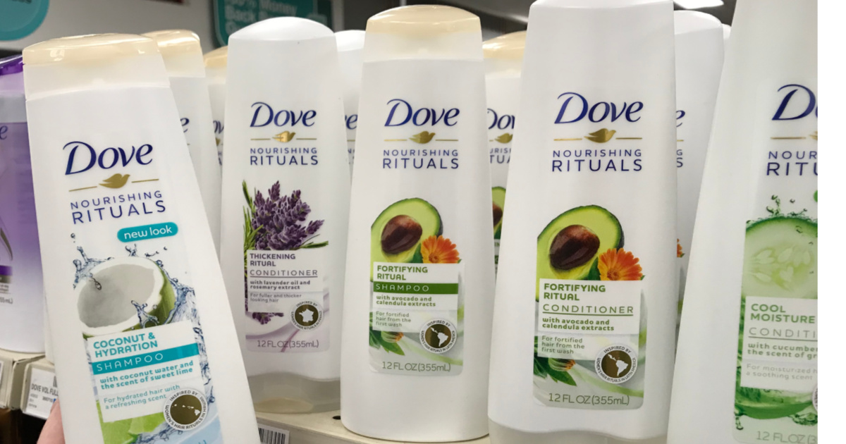 four bottle of dove shampoo on shelf