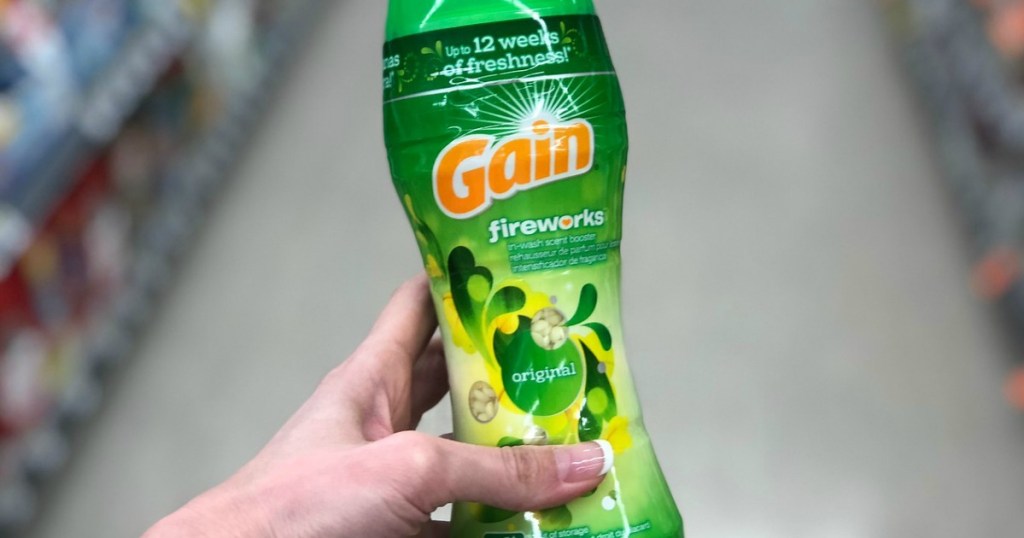 hand holding a bottle of Gain fireworks