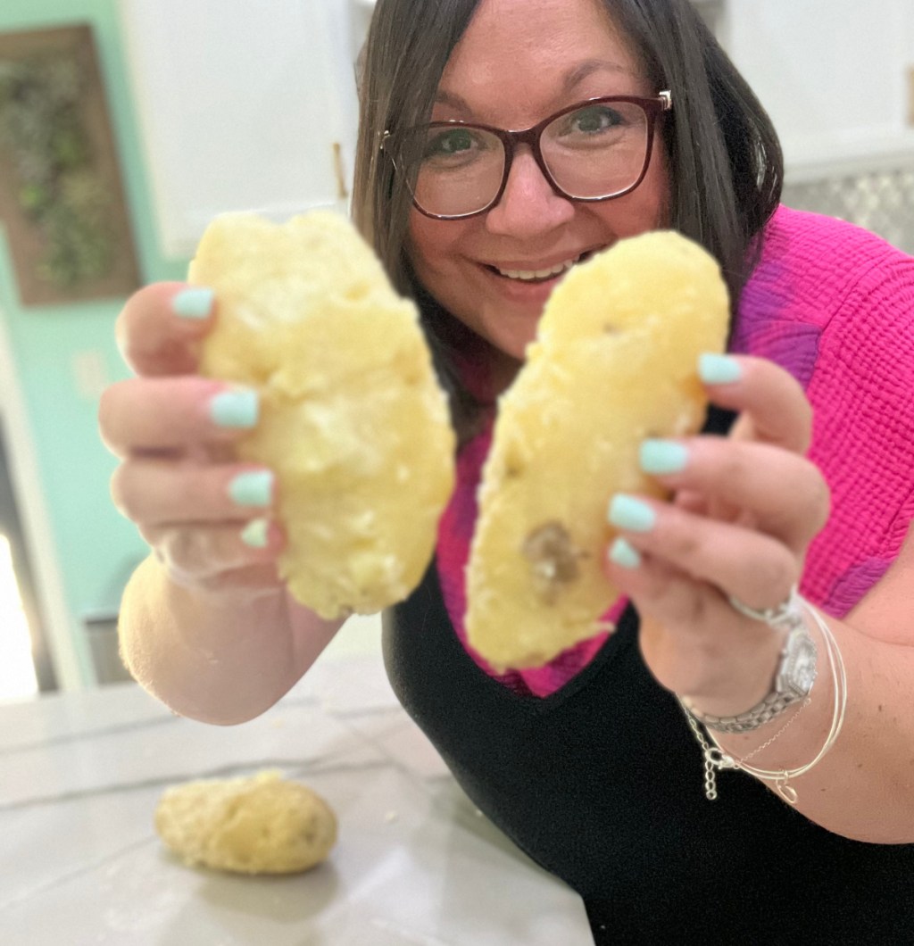 woman using food hacks to peel a potato quickly