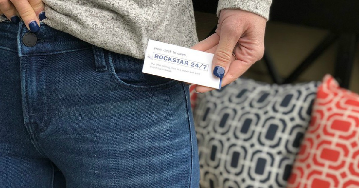 hand holding tag of Rockstar Jeans