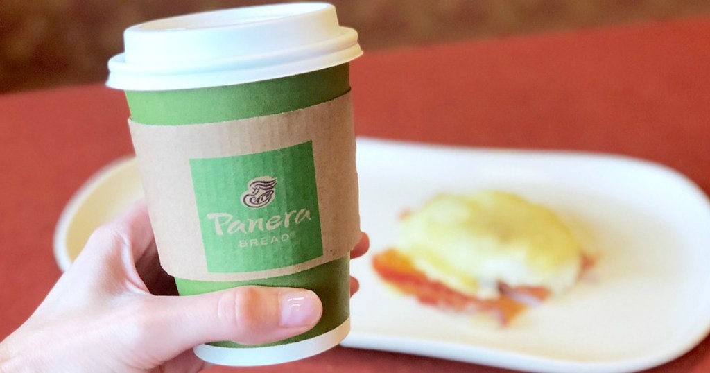 hand holding coffee from Panera Bread