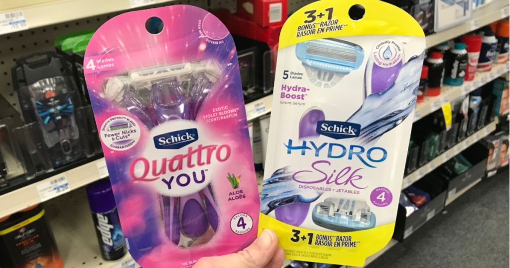two packs of disposable razors in front of shelf 