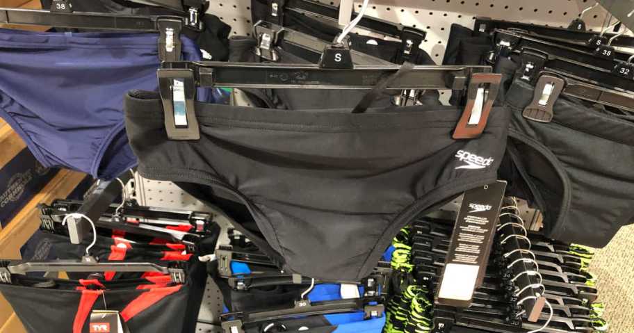 A number of Speedo bottoms hung in a store