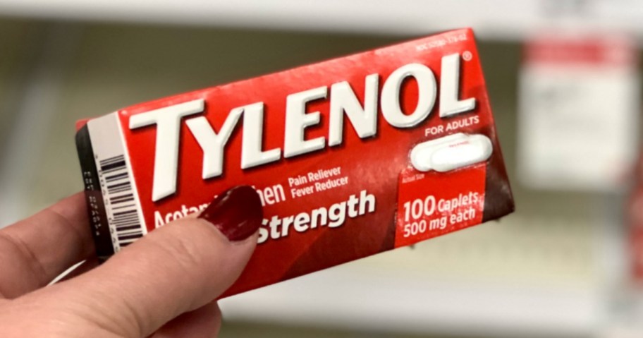 hand holding box of Tylenol