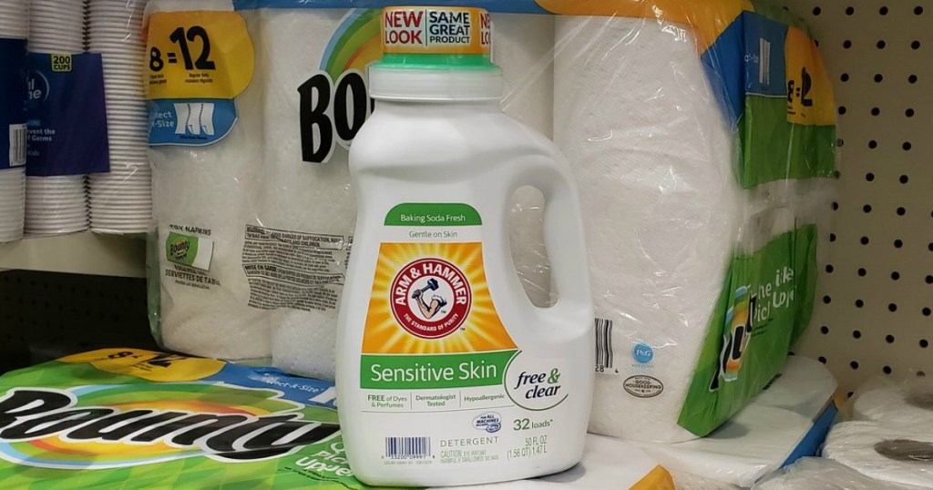 arm and hammer detergent sitting on bounty paper towels