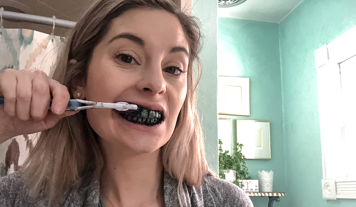 brushing teeth with powdered activated charcoal