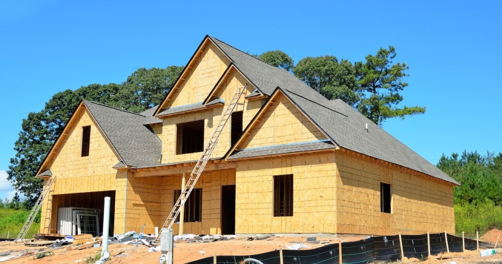 couples dealing with finances - building a new home house construction site