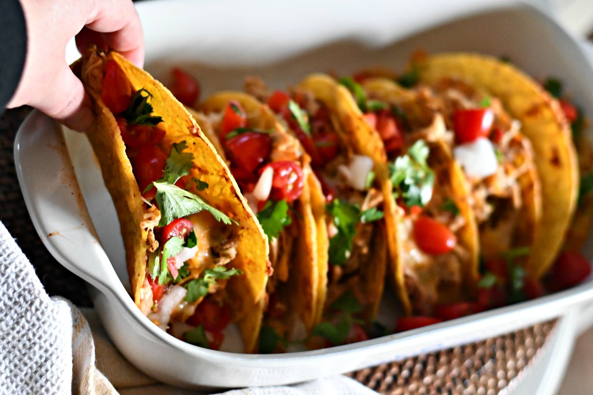 Slow Cooker Chicken Tacos - served up with tomatoes, lettuce, and cilantro