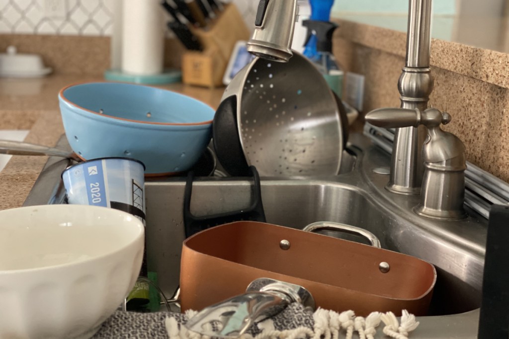 Dishes piled up in sink