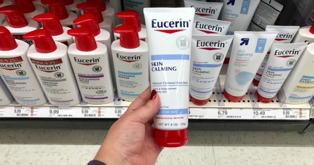 hand holding eucerin skin calming cream