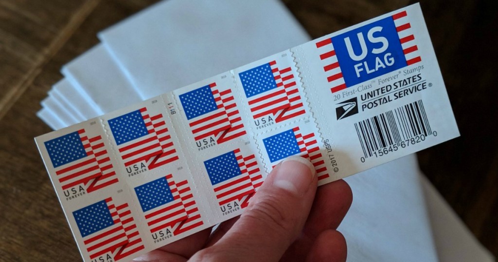 Holding a pack of stamps