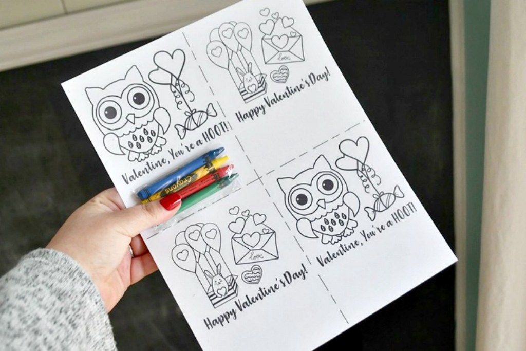holding printable Valentine's Day coloring sheet