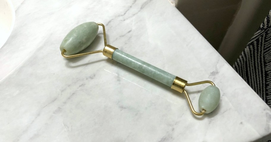 jade roller on bathroom counter