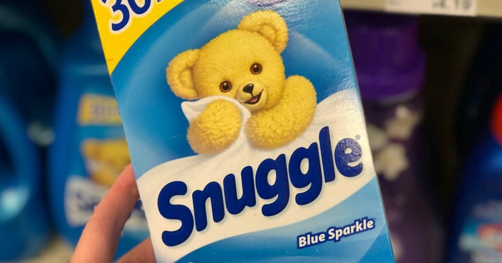 hand holding package of Snuggle Blue Sparkle Dryer Sheets