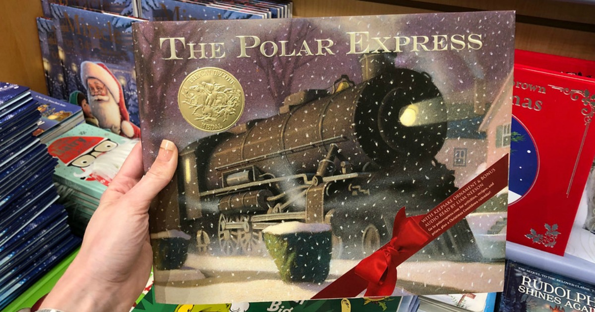 the polar express hardcover book held in hand at store