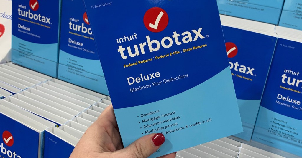 hand holding turbo tax software 