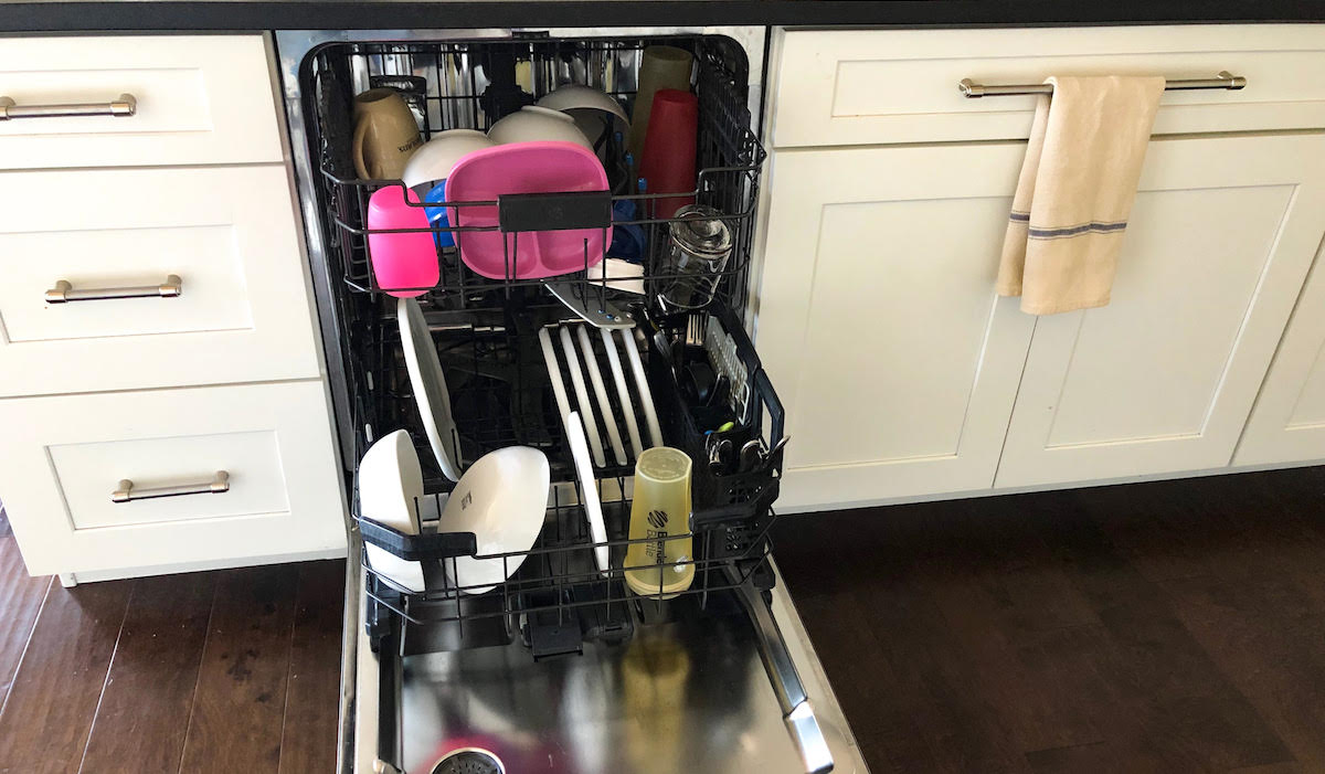 unload the full dishwasher of dishes dirty clean