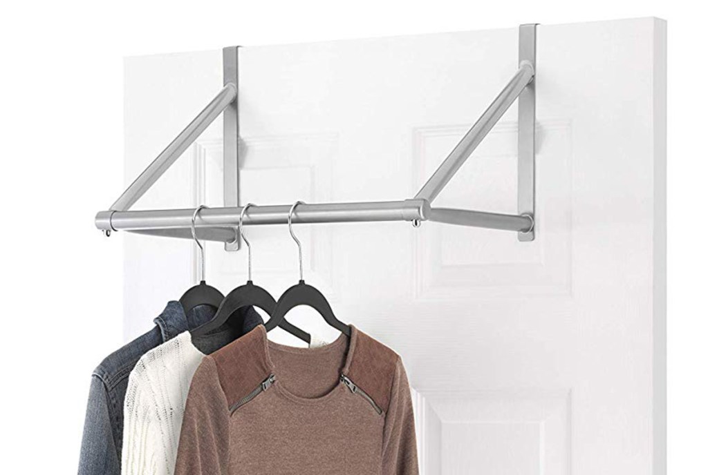 Whitmor Over The Door Metal Closet Rod on a door with shirts hanging from hangers