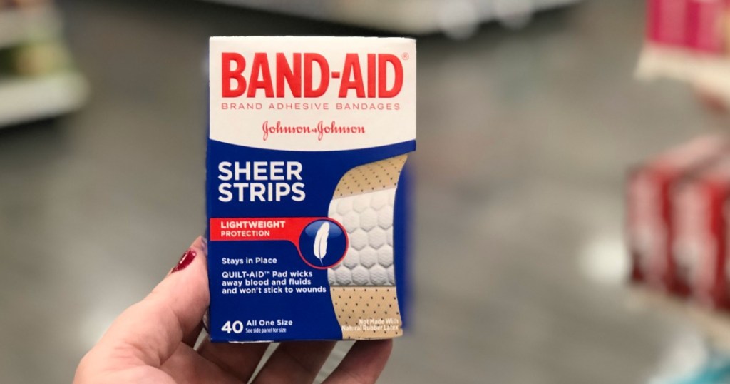 hand holding Band-Aid sheer strips