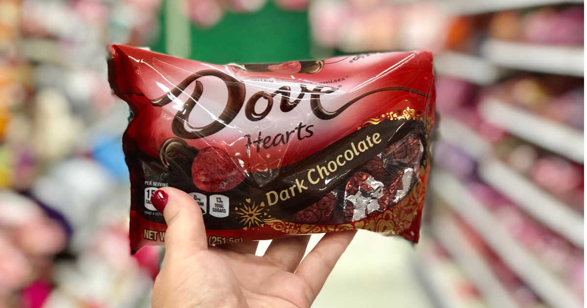 hand holding a bag of dove heart dark chocolate