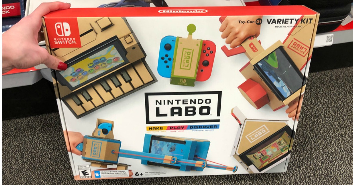hand holding Nintendo LABO Variety Kit on floor