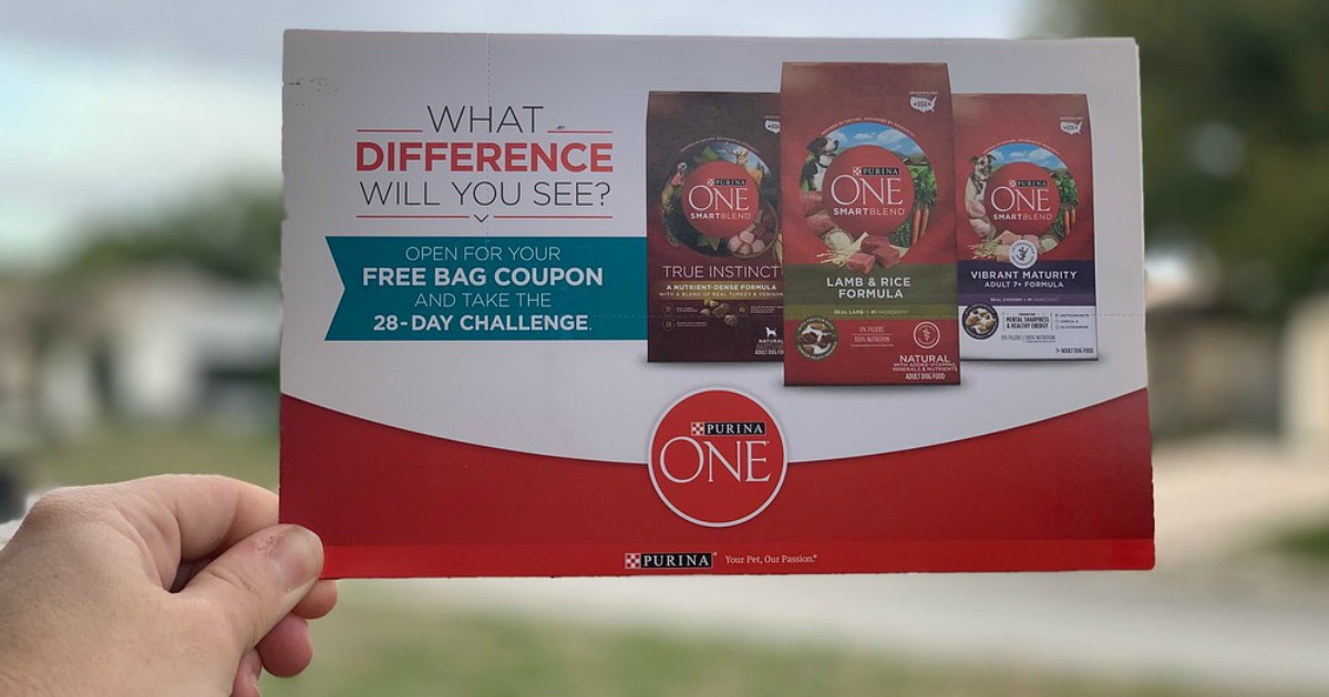 Purina 28 Day Challenge Coupon held in hand
