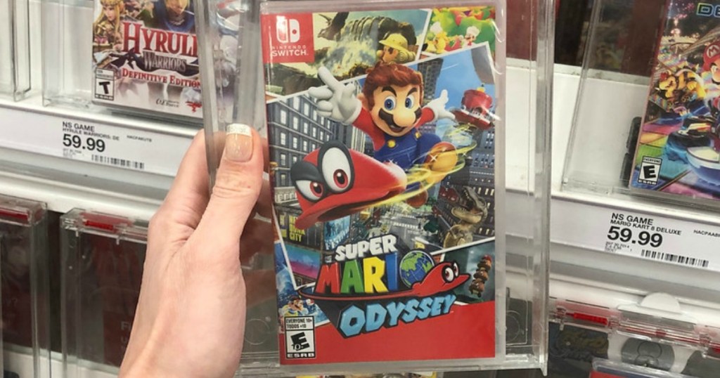 manicured hand holding Mario Odyssey for Nintendo Switch game