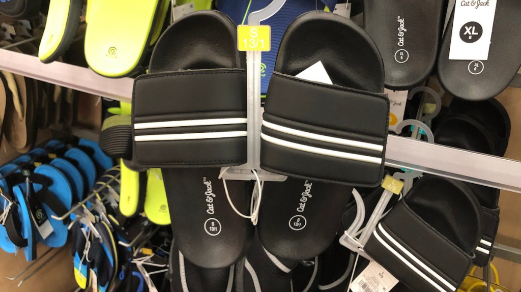 black and white slides with shoes in the background