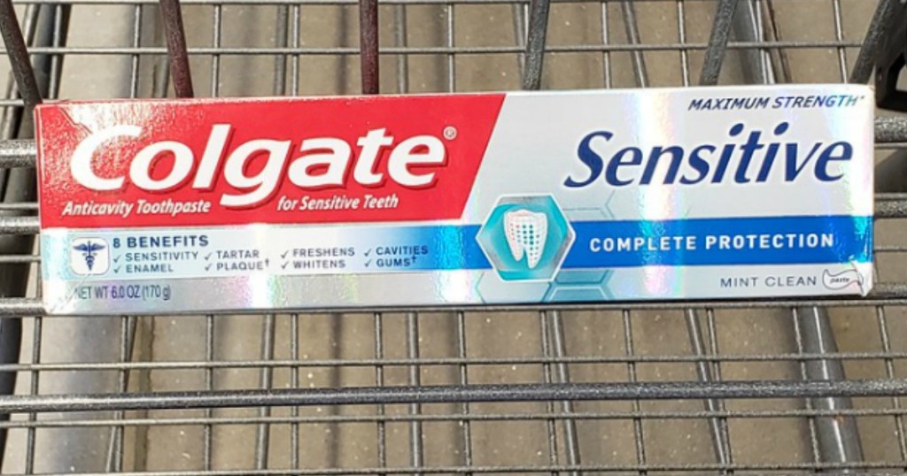 colgate sensitive toothpaste in a cart
