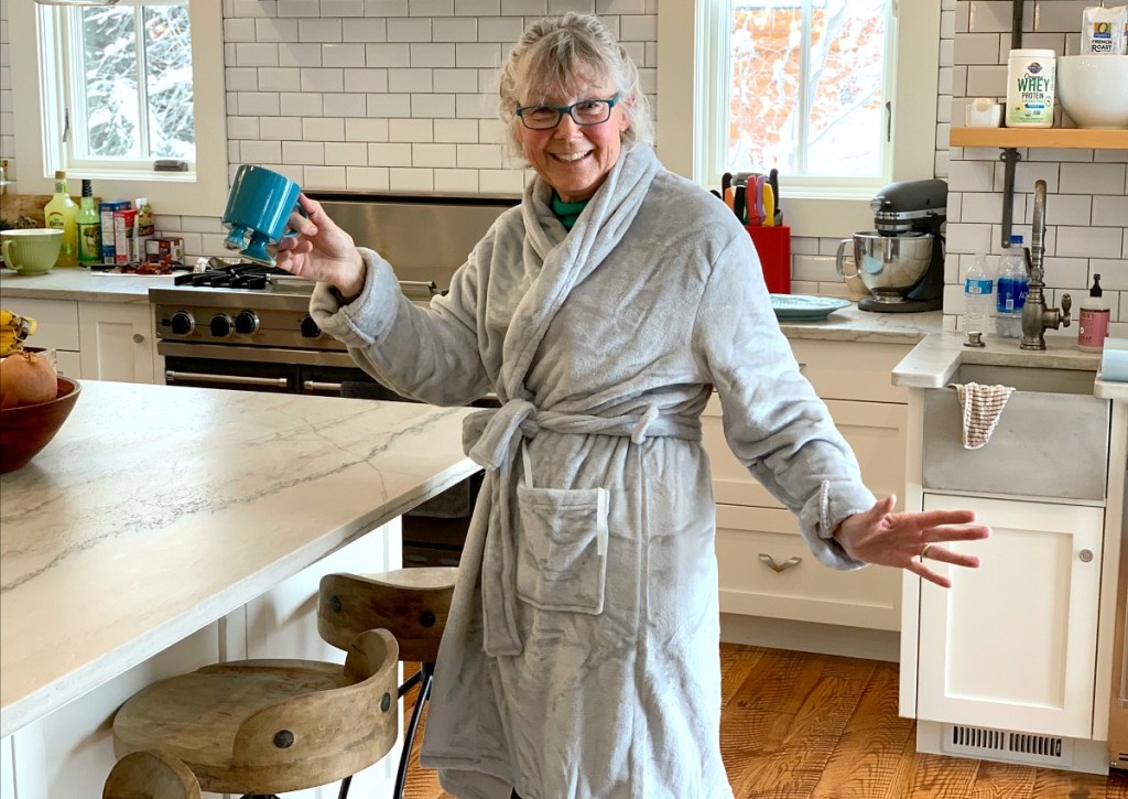 walmart wednesday — collin's mom wearing plush bathrobe and holding coffee mug