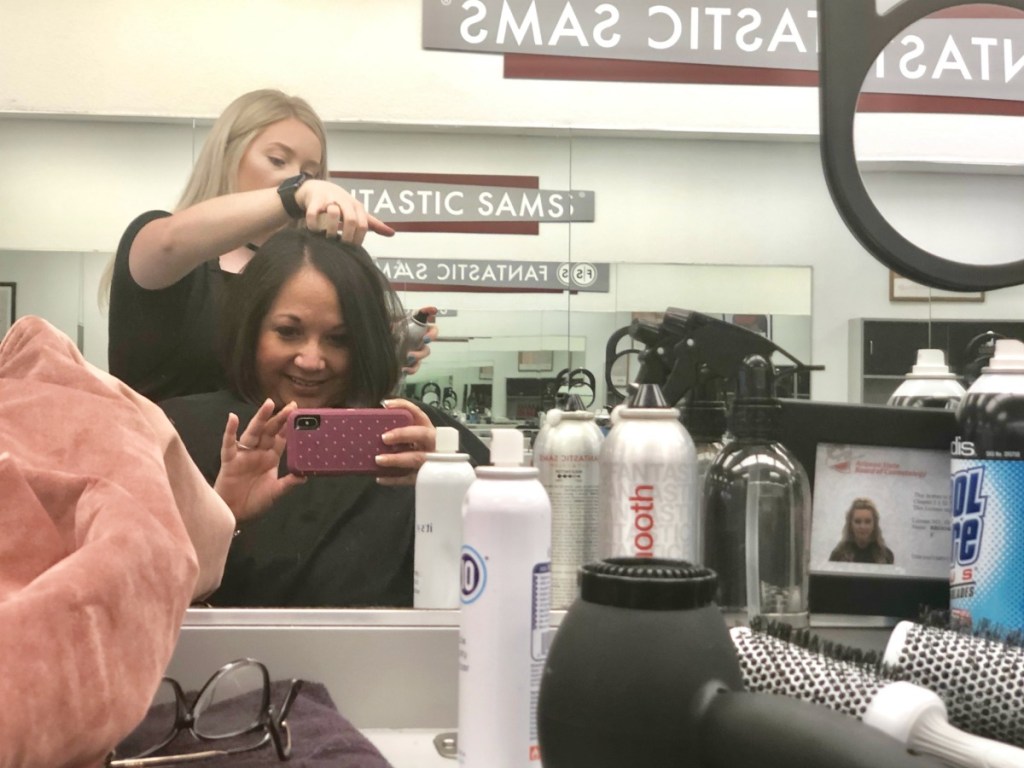 woman getting a haircut 