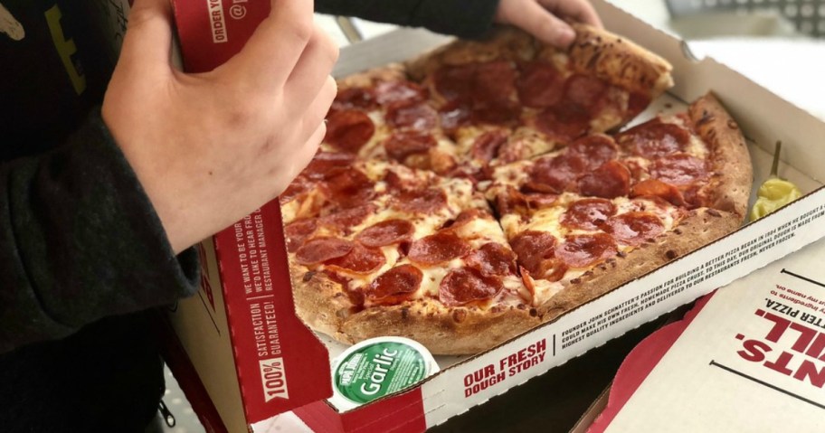 Man holding papa john's pizza box