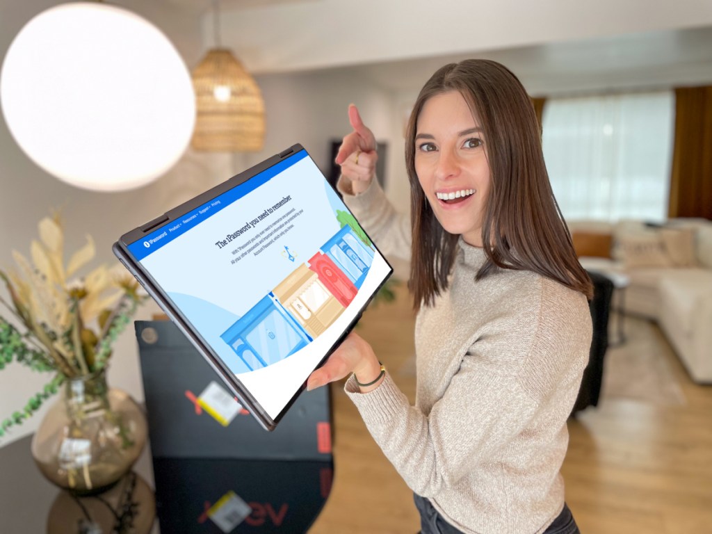 Woman pointing at computer screen, that features 1Password sign up page