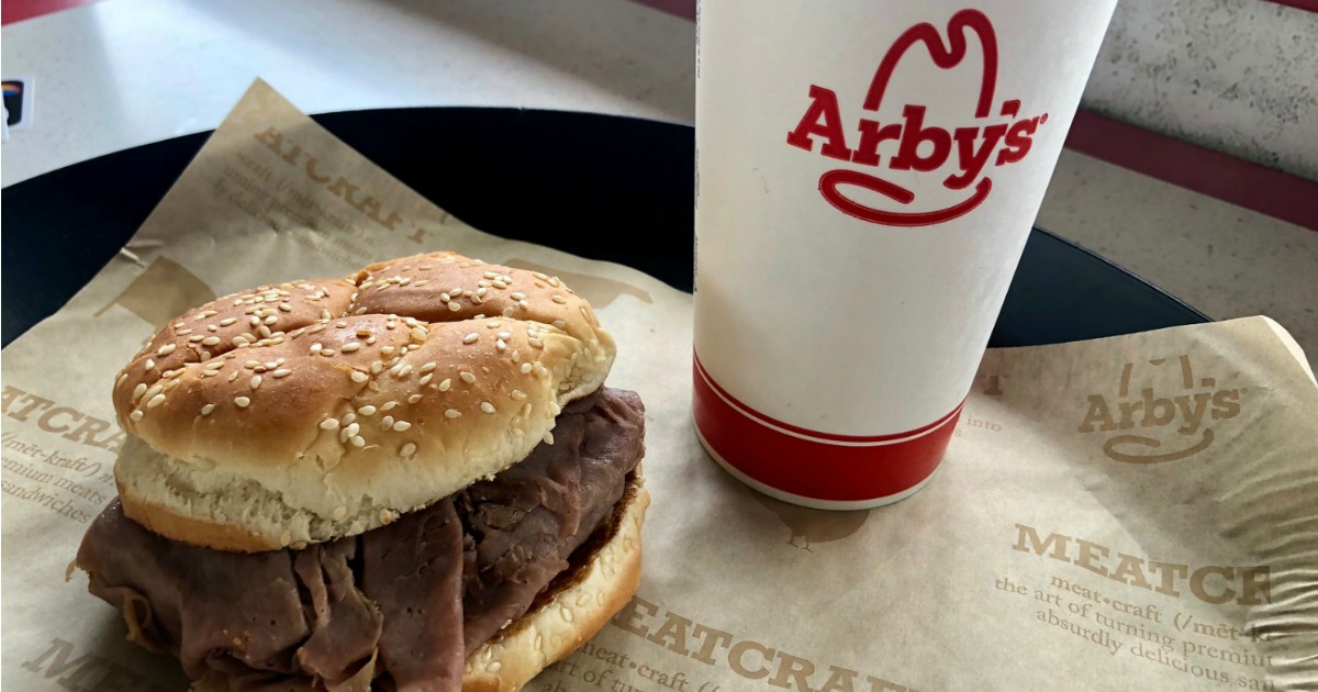 arby's coupons used to purchase a roast beef sandwhich and drink, displayed on a tray at the restaurant