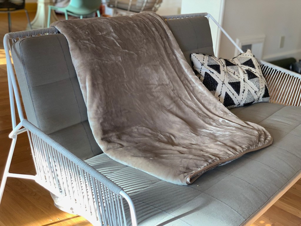 Brookstone Weighted Blanket across couch