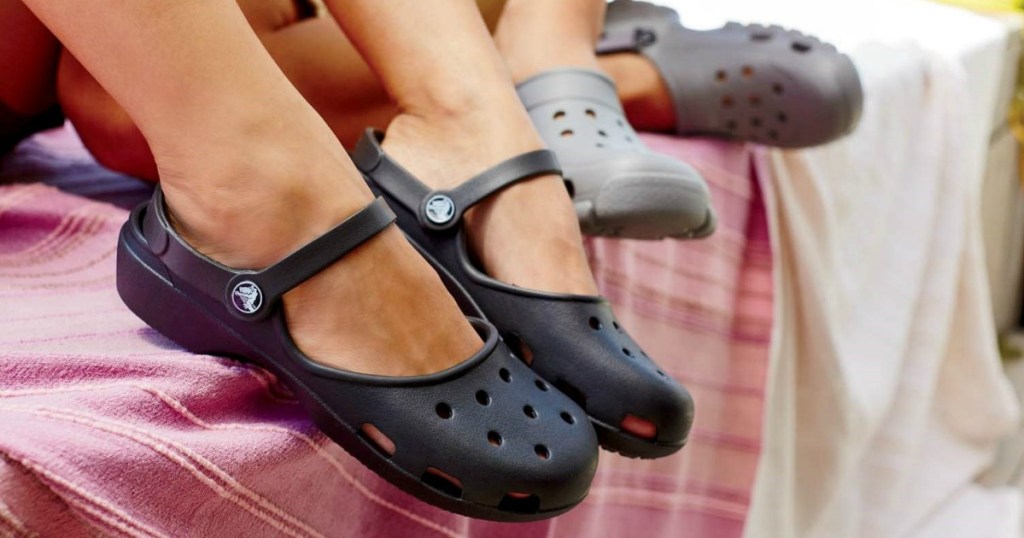 Crocs Karin style shoes in black and gray on women's feet 