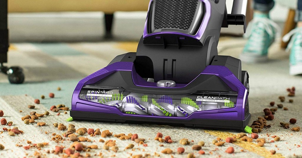purple vacuum on carpet