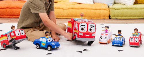 little boy playing with Disney Junior Firebuds, Bo & Flash Rescue Adventure Fire Truck