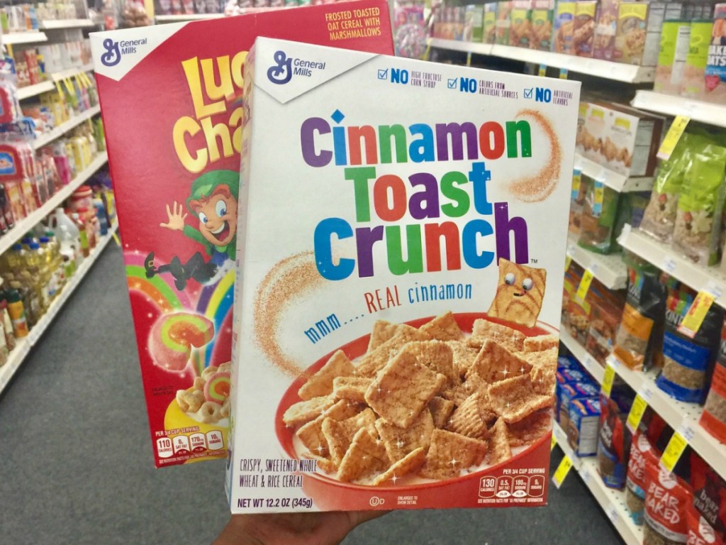 Cereal boxes in hand in-store