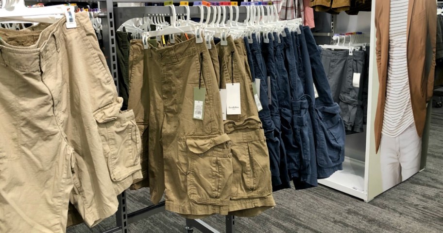 mens cargo shorts on a rack in a store