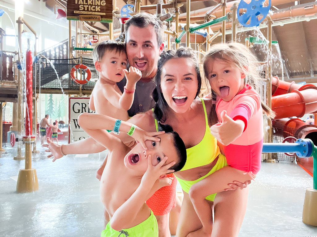 Family standing together at a waterpark