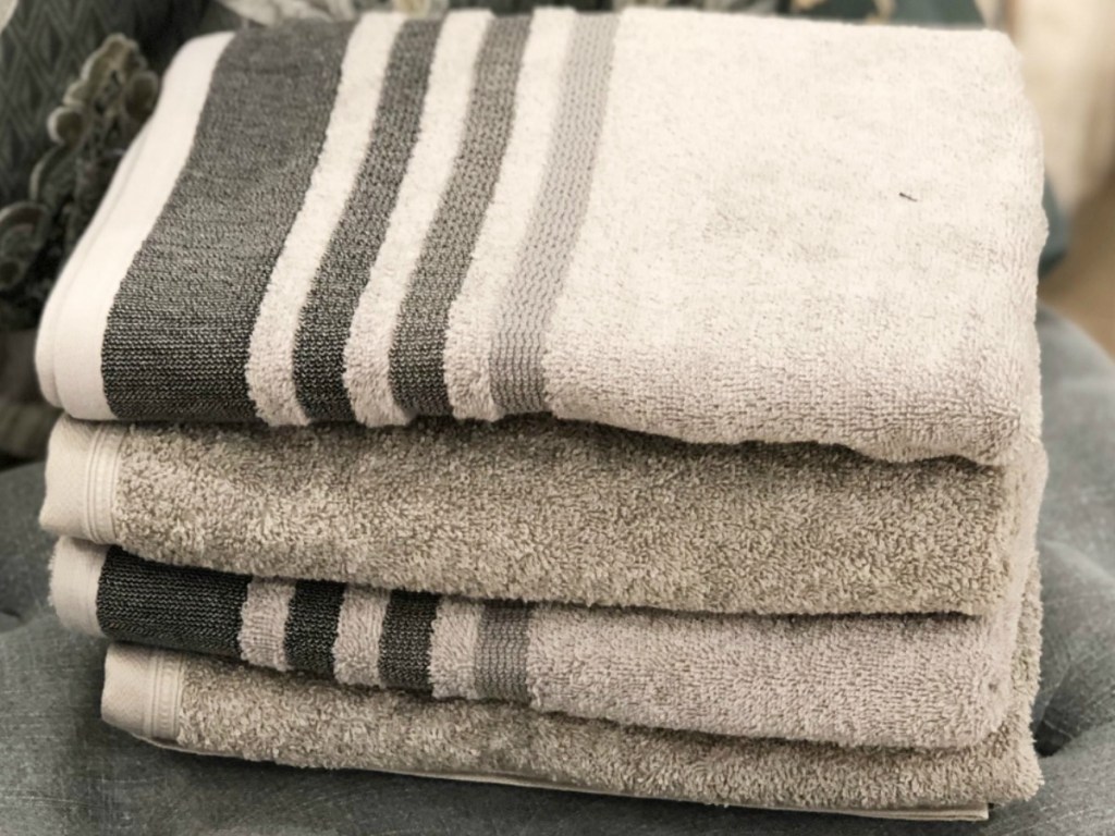 Home Expressions Solid and Striped Bath Towels folded 