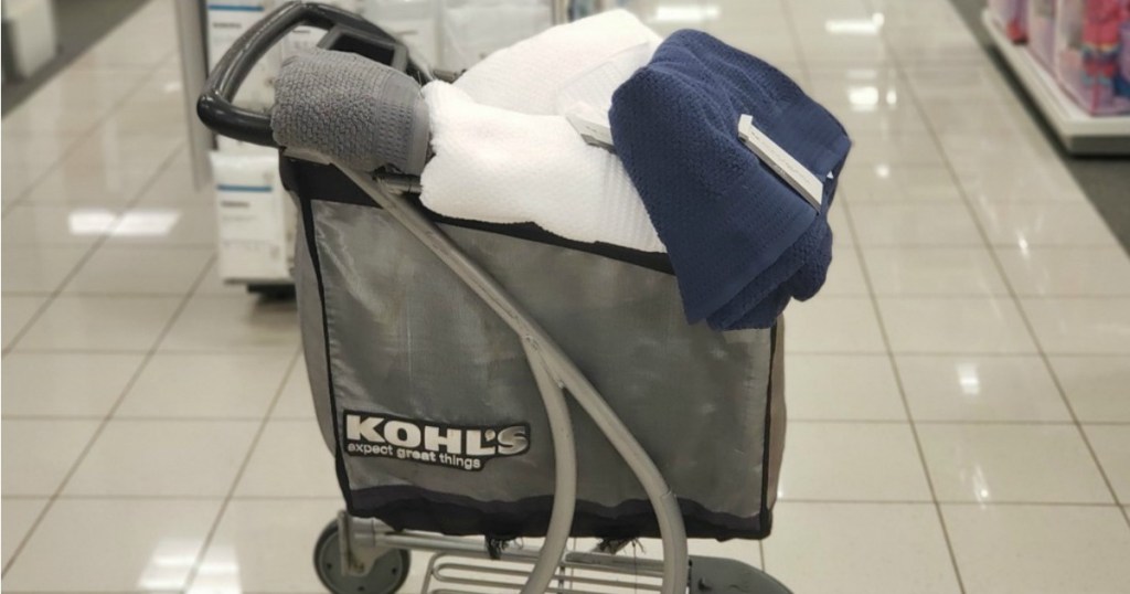 shopping cart in a store with towels in it