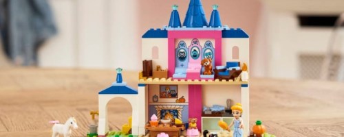 LEGO disney cinderella and animal friends castle on kitchen table with character pieces around castle