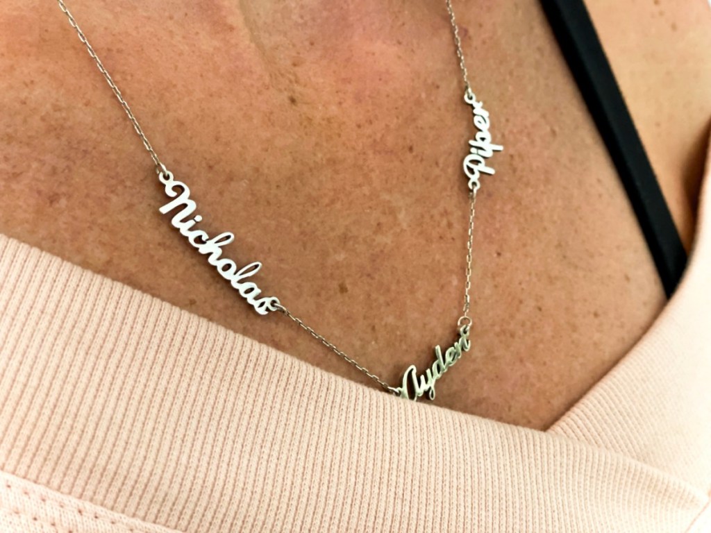Woman wearing name necklace